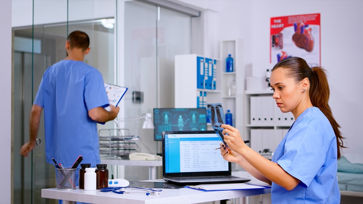 Healthcare professionals working in lab; automated ctms tools concept