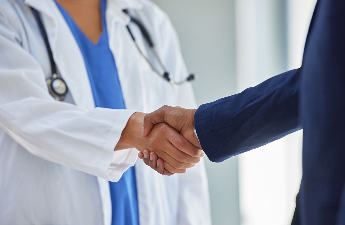 Doctor shaking hands with professional; MSL pharma information concept