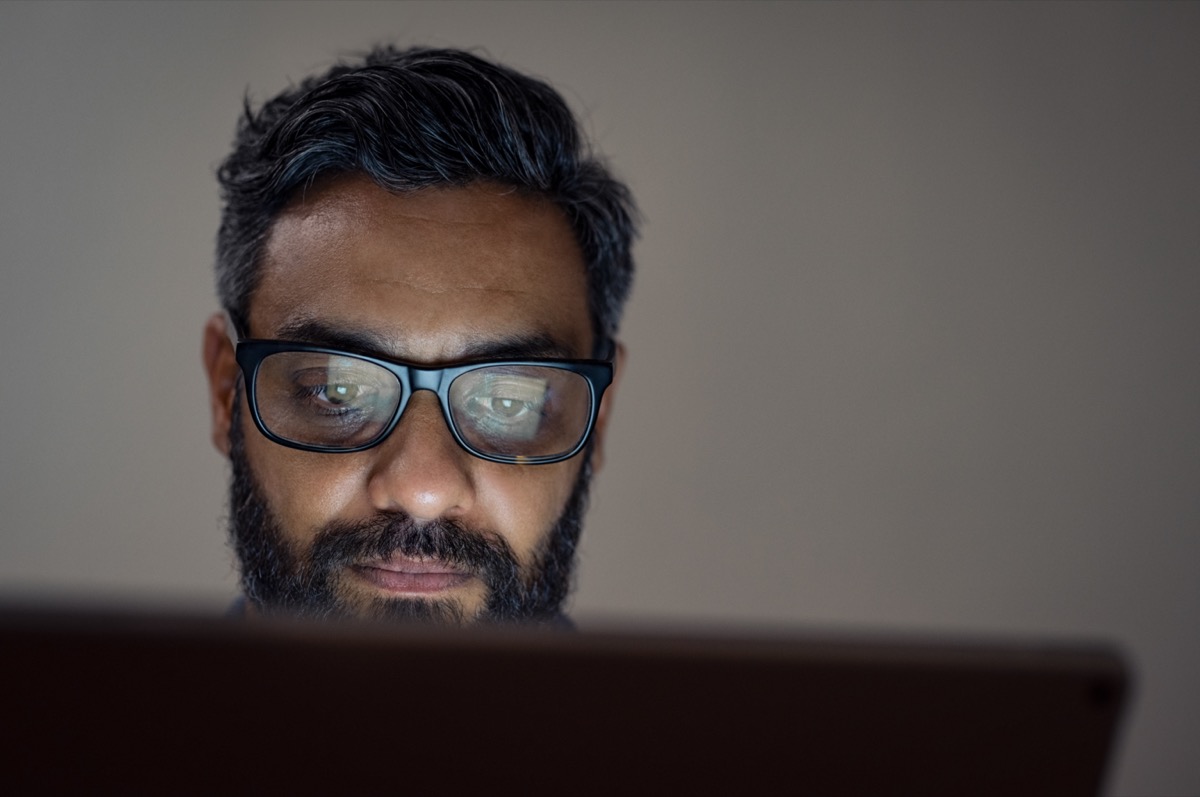 Man working on computer; medical publishing concept