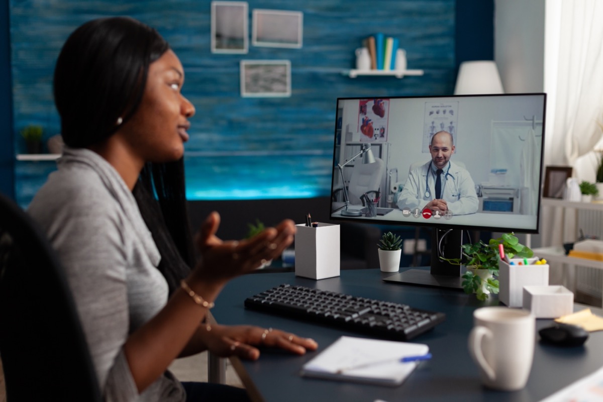 woman talking to medic on video call to receive medical advice; fda decentralized trials concept