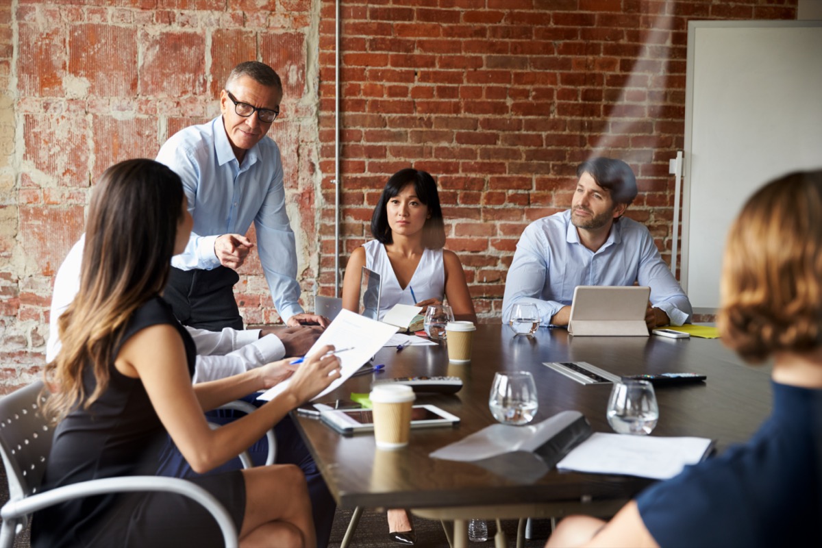 Group of business professionals meeting in boardroom; KOL connections concept