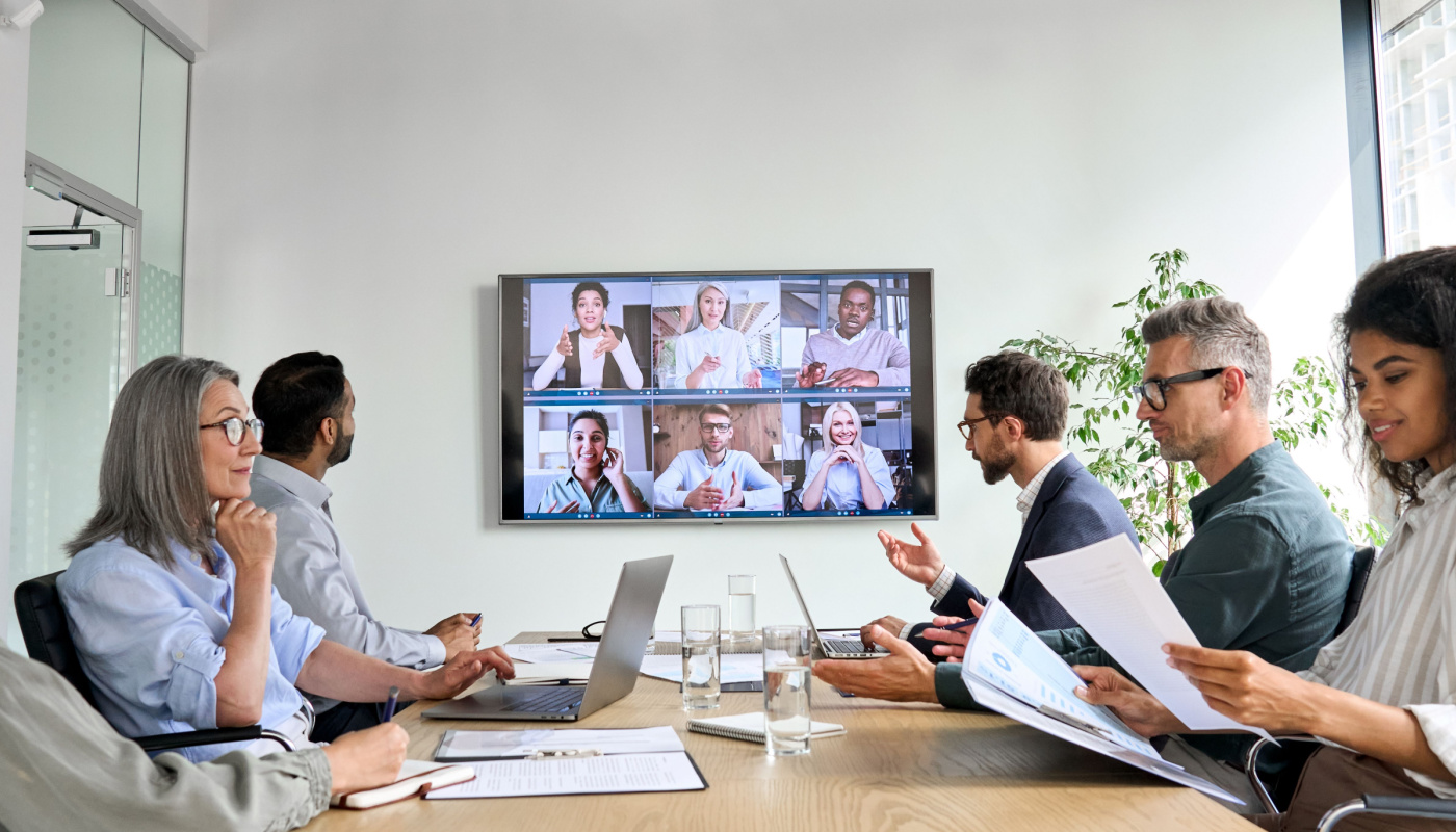 Business professionals having online conference video call in board meeting room.; lack of data integration concept