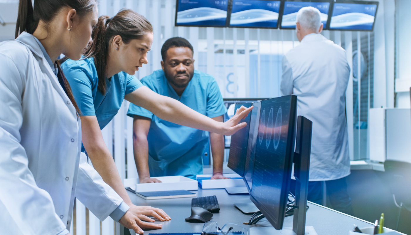 Group of healthcare professionals discussing findings; clinical trial endpoints concept