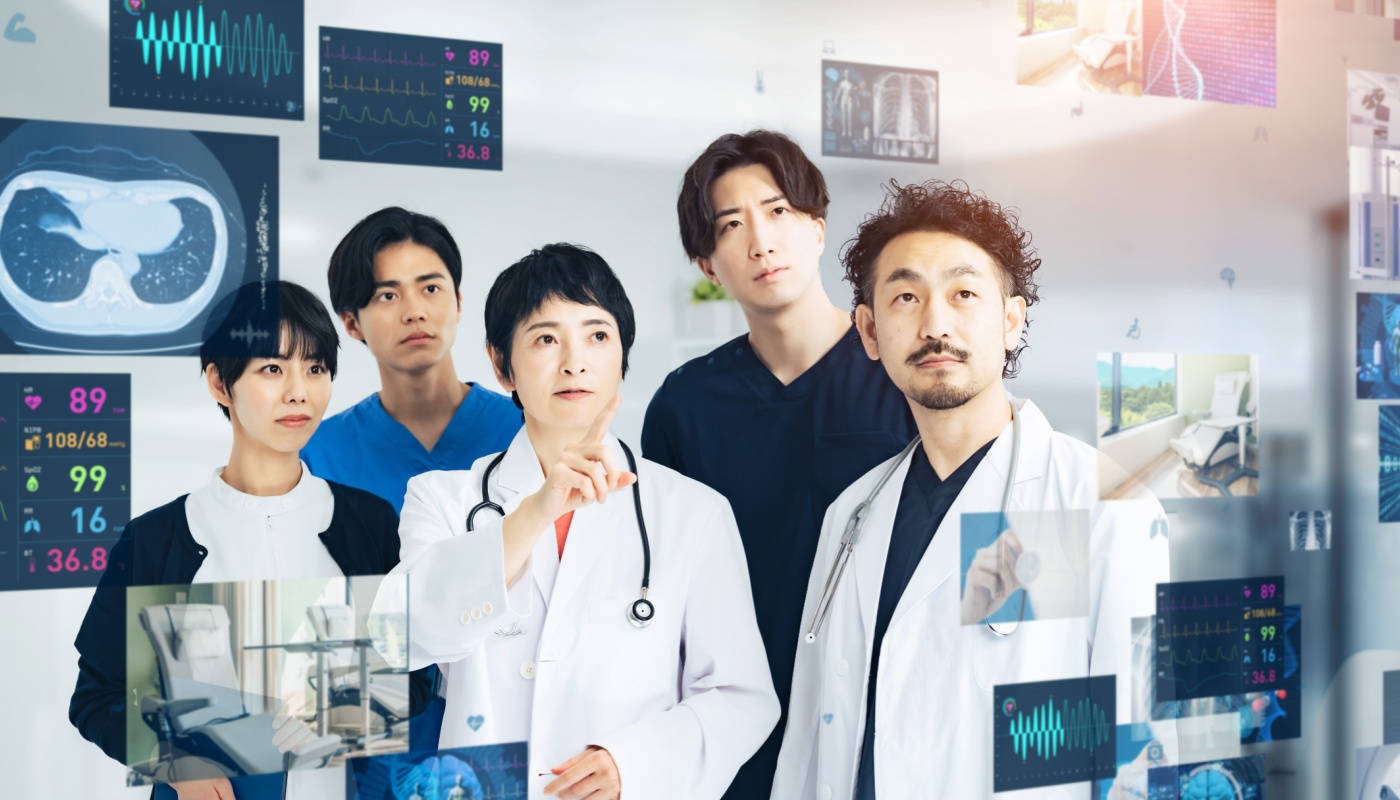 Healthcare professionals looking at hologram screens in hospital lab; predictive analytics concept