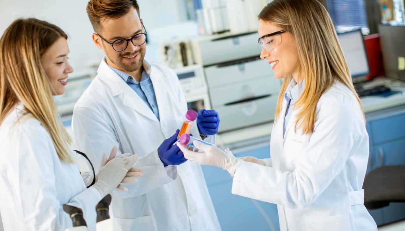 Researchers analyzing chemical data in the laboratory; predictive analytics concept